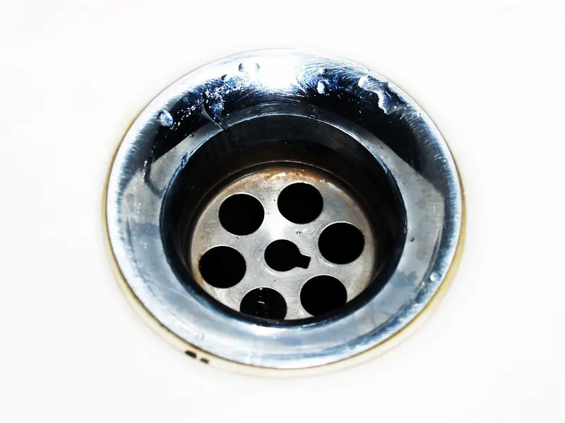 Drain cleaning in Miami: sink drain close-up