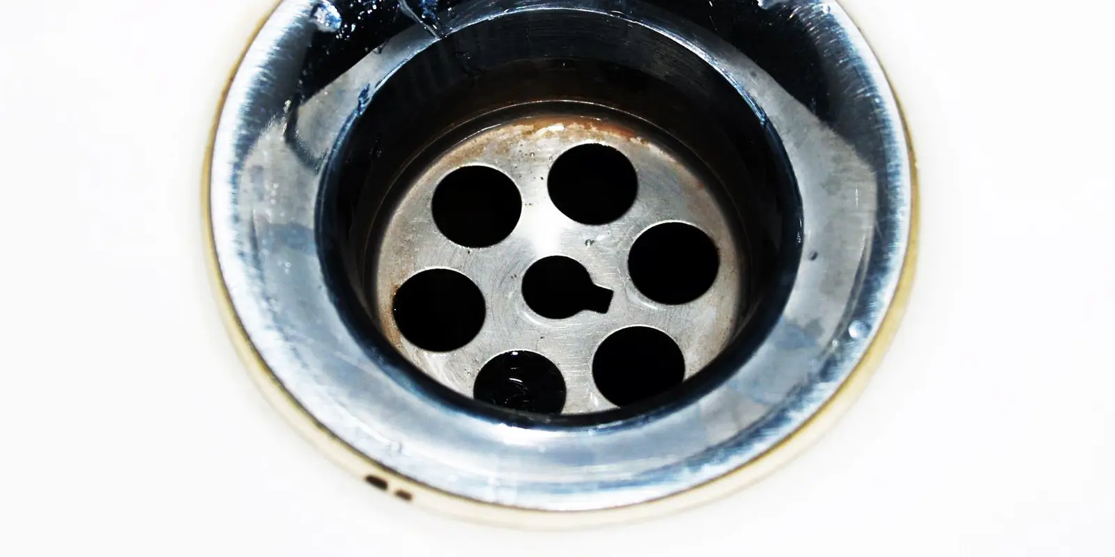 Drain cleaning in Miami: sink drain close-up