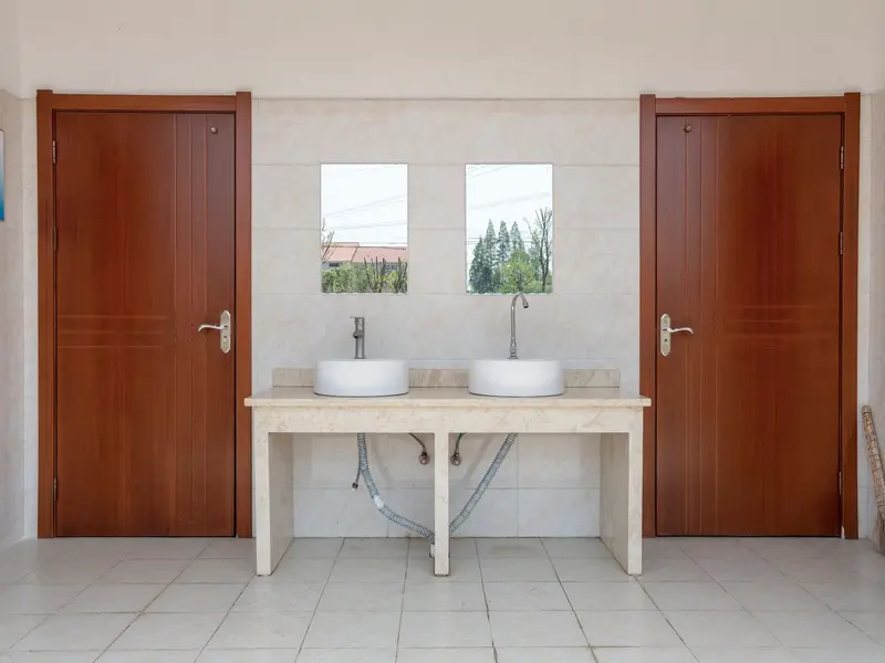 Office plumbing in Miami: office restroom with twin sinks