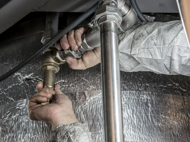 Water heater service in Miami: plumber fitting supply pipes